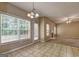 Bright dining room with tile floor, large windows, and seamless access to the living area at 2093 Parador Bnd, Mcdonough, GA 30253
