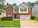 Charming two-story home with well-maintained lawn, brick facade, and attached two-car garage at 2093 Parador Bnd, Mcdonough, GA 30253