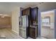 An elegant kitchen seamlessly opens to a cozy living area with stainless steel refrigerator at 2093 Parador Bnd, Mcdonough, GA 30253