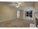 Open concept living room with carpet flooring and an inviting view to the kitchen at 2093 Parador Bnd, Mcdonough, GA 30253