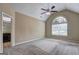 Spacious main bedroom with a large arched window and a ceiling fan at 2093 Parador Bnd, Mcdonough, GA 30253