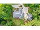 Aerial view showcases the beautiful home, driveway, and surrounding greenery at 285 Spear Rd, Peachtree City, GA 30269