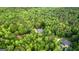 Secluded property surrounded by dense woodlands, featuring a well-maintained home and a tranquil natural setting at 285 Spear Rd, Peachtree City, GA 30269