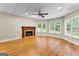 The finished basement features hardwood flooring, a cozy fireplace and natural light at 285 Spear Rd, Peachtree City, GA 30269