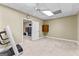 Basement gym area showcasing carpeted flooring and access to additional rooms at 285 Spear Rd, Peachtree City, GA 30269