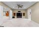 Spacious basement area featuring plush carpeting and a modern ceiling fan for added comfort at 285 Spear Rd, Peachtree City, GA 30269