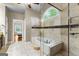 This bathroom features a soaking tub, glass shower, and natural light at 285 Spear Rd, Peachtree City, GA 30269