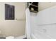 Bathroom featuring a white tiled shower-tub combo, dark wood cabinet and grab bar at 285 Spear Rd, Peachtree City, GA 30269