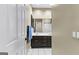 Bathroom with a double sink vanity, dark wood cabinets, and white tile flooring at 285 Spear Rd, Peachtree City, GA 30269