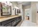 This bathroom features a dual sink vanity and tile floors at 285 Spear Rd, Peachtree City, GA 30269