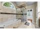This bathroom features a soaking tub and a glass shower at 285 Spear Rd, Peachtree City, GA 30269