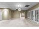 The bonus room features carpet floors, double doors, and a light fixture at 285 Spear Rd, Peachtree City, GA 30269