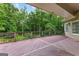 Large, stained deck overlooks a lush backyard, great for entertaining or enjoying peaceful outdoor moments at 285 Spear Rd, Peachtree City, GA 30269