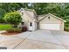 Home featuring an attached garage and driveway at 285 Spear Rd, Peachtree City, GA 30269