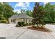 Charming home featuring an attached three car garage and lush landscaping at 285 Spear Rd, Peachtree City, GA 30269