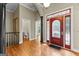 Welcoming foyer with hardwood floors, elegant columns, and view to a bathroom at 285 Spear Rd, Peachtree City, GA 30269