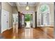 Elegant foyer with hardwood floors, arched entryways, and a view of the front yard at 285 Spear Rd, Peachtree City, GA 30269