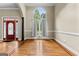 Elegant foyer featuring hardwood floors, a large window, and front door at 285 Spear Rd, Peachtree City, GA 30269