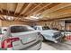 Garage containing two cars and fluorescent lighting at 285 Spear Rd, Peachtree City, GA 30269