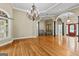 Expansive living room with hardwood floors, coffered ceilings, and a chandelier at 285 Spear Rd, Peachtree City, GA 30269