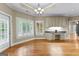 Bright living space with custom cabinetry, a granite countertop, and shuttered windows at 285 Spear Rd, Peachtree City, GA 30269