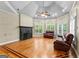 Vaulted ceiling living room with hardwood floors, a fireplace, and a seating area with window views at 285 Spear Rd, Peachtree City, GA 30269