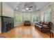 Spacious living room featuring a fireplace, hardwood floors, large windows, and recessed lighting at 285 Spear Rd, Peachtree City, GA 30269