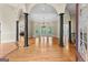 Spacious living room with hardwood floors, columns, and large windows at 285 Spear Rd, Peachtree City, GA 30269