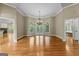 Large living room with hardwood floors, tall ceilings, and bright natural light at 285 Spear Rd, Peachtree City, GA 30269