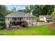 Spacious backyard with a multi-level deck, perfect for outdoor entertaining and enjoying the serene surroundings at 285 Spear Rd, Peachtree City, GA 30269