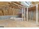 Unfinished attic area with insulation and wood floor at 285 Spear Rd, Peachtree City, GA 30269