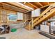 Unfinished basement with a stairway at 285 Spear Rd, Peachtree City, GA 30269