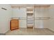 Walk-in closet featuring built-in shelving and wooden drawers to maximize the use of storage space at 550 Hawthorne Dr, Fayetteville, GA 30214