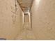 View of a long unfinished storage room, showing stucco walls at 550 Hawthorne Dr, Fayetteville, GA 30214