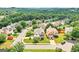 Overhead view of a residential neighborhood with mature trees, manicured lawns, and well-maintained homes at 910 Pebble Creek Trl, Suwanee, GA 30024
