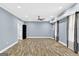 The spacious finished basement features a ceiling fan and wood-look flooring at 910 Pebble Creek Trl, Suwanee, GA 30024