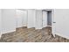 The basement features wood flooring, closets, and access to the unfinished area at 910 Pebble Creek Trl, Suwanee, GA 30024