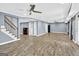 Finished basement features wood flooring, recessed lighting, and staircase at 910 Pebble Creek Trl, Suwanee, GA 30024