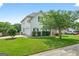 Charming two-story home with a well-manicured lawn, mature landscaping, and an attached two car garage at 910 Pebble Creek Trl, Suwanee, GA 30024