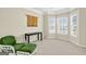 Comfortable living area with lots of natural light, neutral paint, and stylish furnishings on soft carpet at 910 Pebble Creek Trl, Suwanee, GA 30024