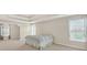 Spacious main bedroom with tray ceilings, multiple windows, neutral walls, and plush carpet at 910 Pebble Creek Trl, Suwanee, GA 30024