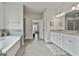 The bathroom features a soaking tub, glass shower, granite countertops and double sinks at 33 Vinery Ct, Sharpsburg, GA 30277