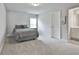 This bedroom features neutral walls, carpet and a window with blinds allowing natural light at 33 Vinery Ct, Sharpsburg, GA 30277