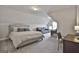 Upper level bonus room with a bed, desk, and comfortable leather couch at 33 Vinery Ct, Sharpsburg, GA 30277