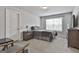 Neutral bedroom featuring carpet, a window, closet and an en suite bathroom for convenience at 33 Vinery Ct, Sharpsburg, GA 30277