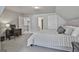 Bright bedroom boasts neutral paint, plush carpet, a bed and desk with great natural light at 33 Vinery Ct, Sharpsburg, GA 30277