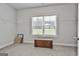 The carpeted bedroom has natural light and a built in closet system at 33 Vinery Ct, Sharpsburg, GA 30277