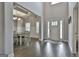 Elegant foyer with dark hardwood floors, decorative ceiling beams, and an adjacent dining area at 33 Vinery Ct, Sharpsburg, GA 30277