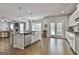 Bright kitchen features a large island with stainless steel sink and modern appliances at 33 Vinery Ct, Sharpsburg, GA 30277