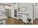 Modern kitchen boasts stainless steel appliances, double oven, and granite countertops with desk at 33 Vinery Ct, Sharpsburg, GA 30277